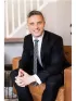 Adam J. Benke,Real Broker